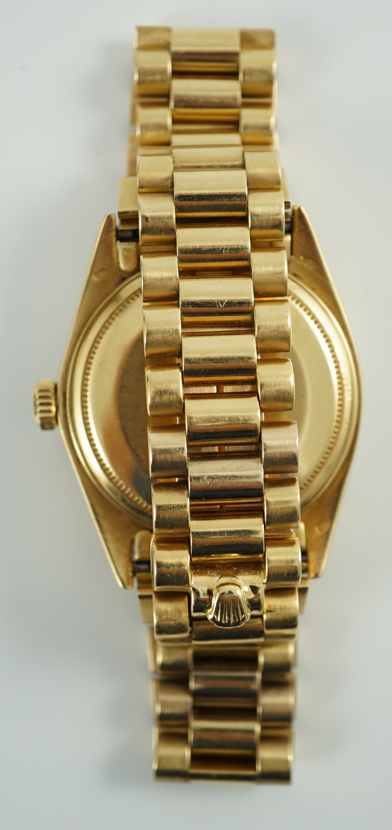 A gentleman's late 1970's 18ct gold Rolex Oyster Perpetual Day-Date wrist watch, with after market diamond set bezel and diamond set markers, on an 18ct gold Rolex bracelet with deployment clasp